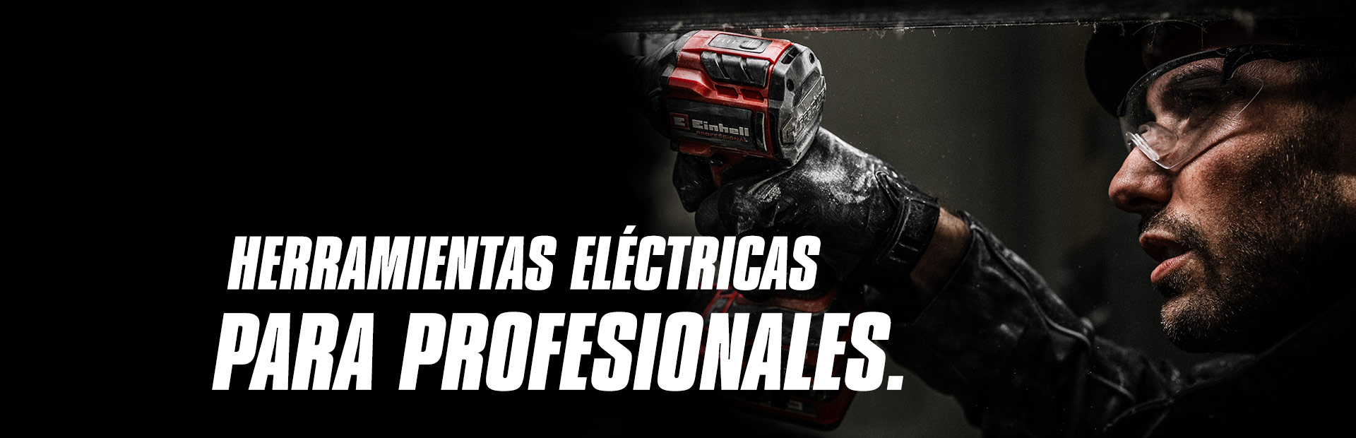 Una mano sostiene una llave de impacto a batería roja que se utiliza en una viga de metal, con el texto "Herramientas Eléctricas para Profesionales".