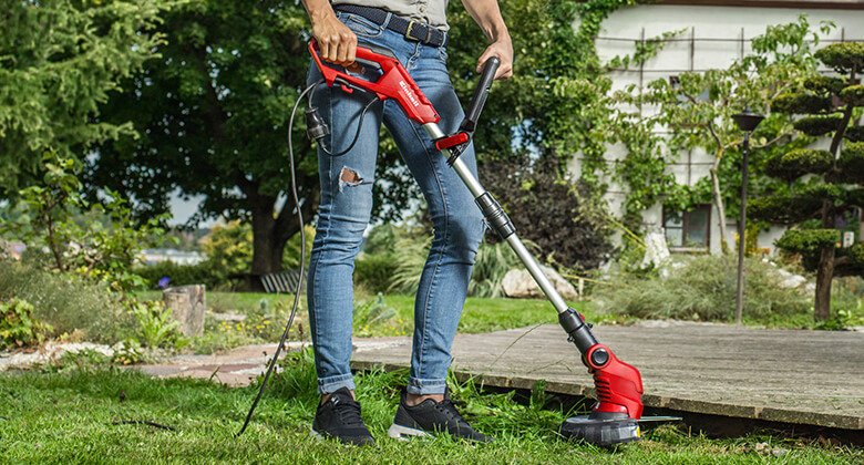 electric lawn trimmer in use