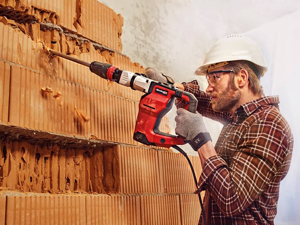 man working with rotary hammer