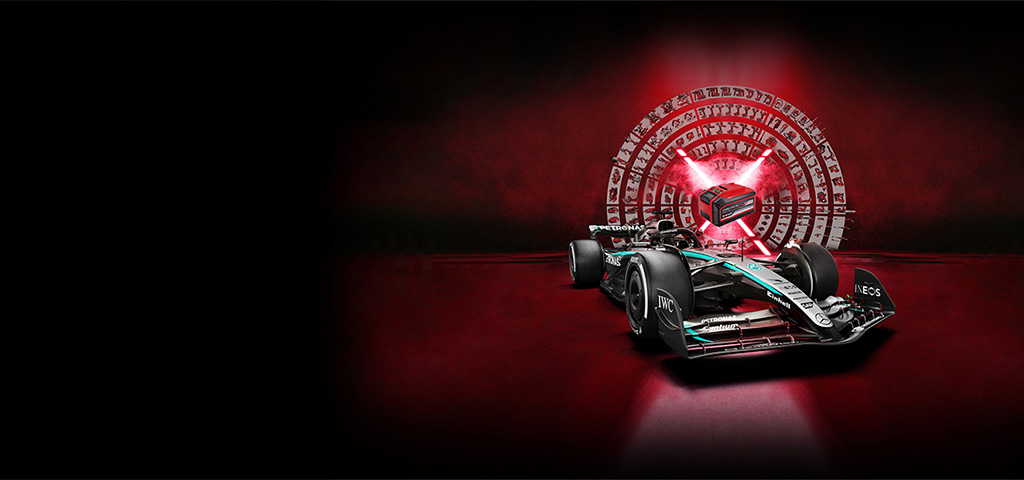 „A Formula 1 race car is in the foreground on a dark red background. In the background, a glowing stylized Power X-Change battery is surrounded by a circular array of Einhell tools and icons – symbolizing power, technology, and versatility.“