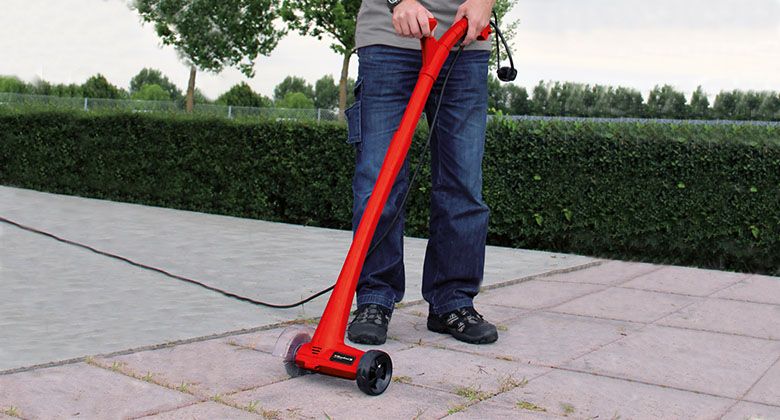 electric grout cleaner in use